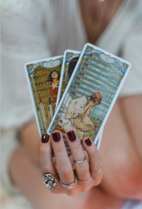 tarot cards, hand holding tarot cards